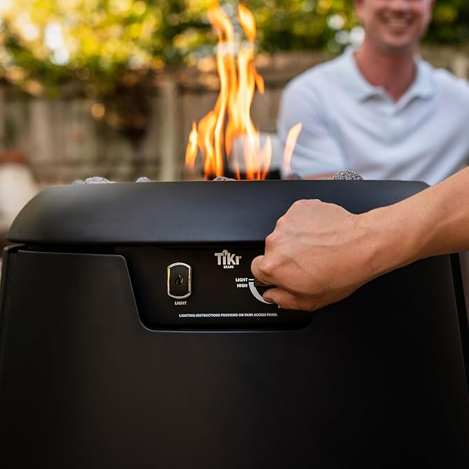 TIKI 28.5-Inch Customizable Propane Fire Pit, 40,000 BTU Outdoor Gas Fire Pit with Lava Rocks & Burner Cover – Modern Black Design for Patio, Backyard, and Outdoor Spaces